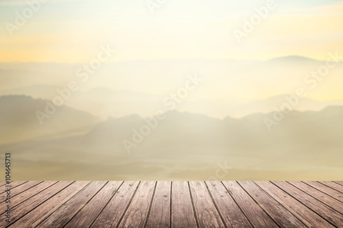 wooden floor with mountain blurred background