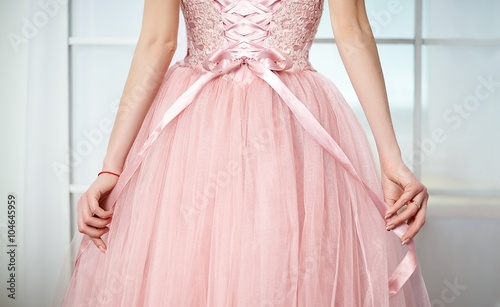 Bride in a pink dress with flowers