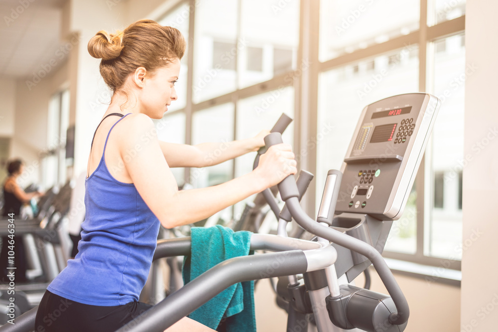 Fototapeta premium Woman training in a gym