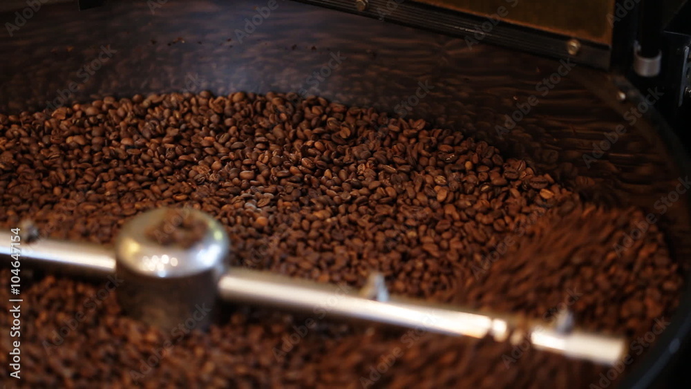 Mixing roasted coffee.