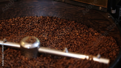 Mixing roasted coffee.
