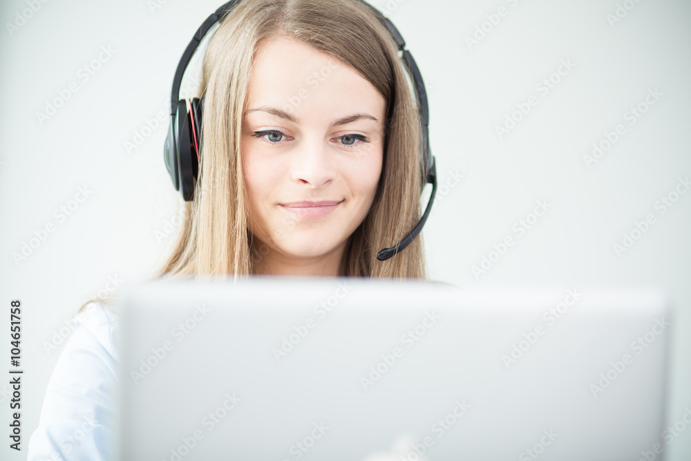 Female consultant using headphones Female consultant using headphones