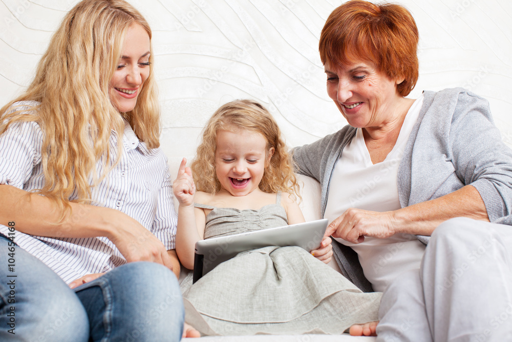 Family wiht tablet computer at sofa Family wiht tablet computer at sofa