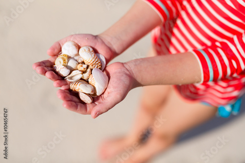 Girl holding sea shells