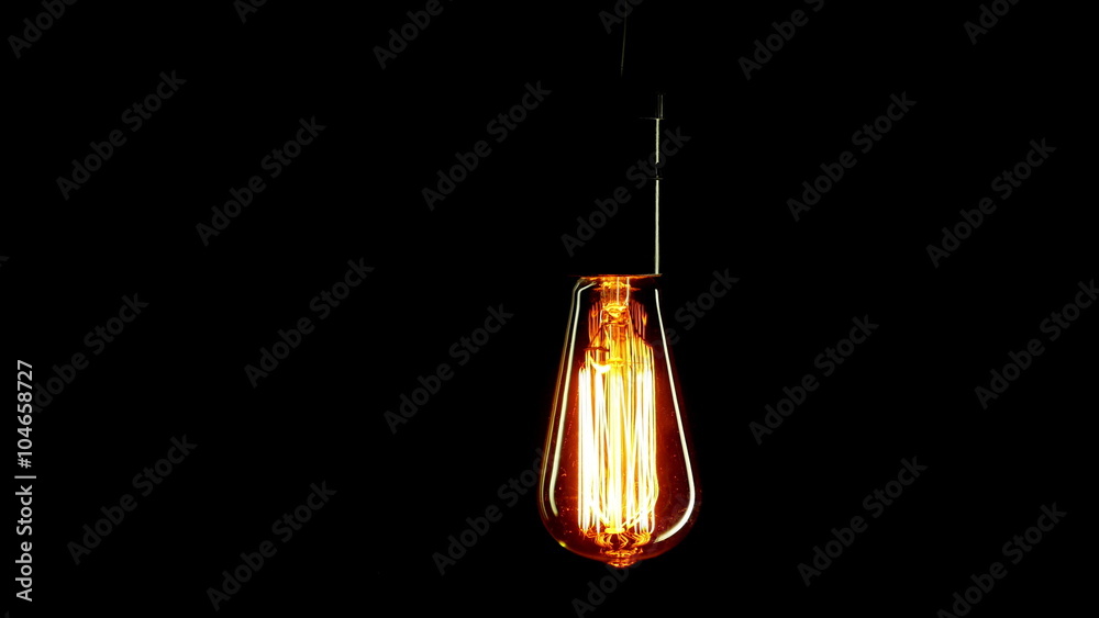 Real Edison light bulb flickering. Vintage filament Edison light bulb.

