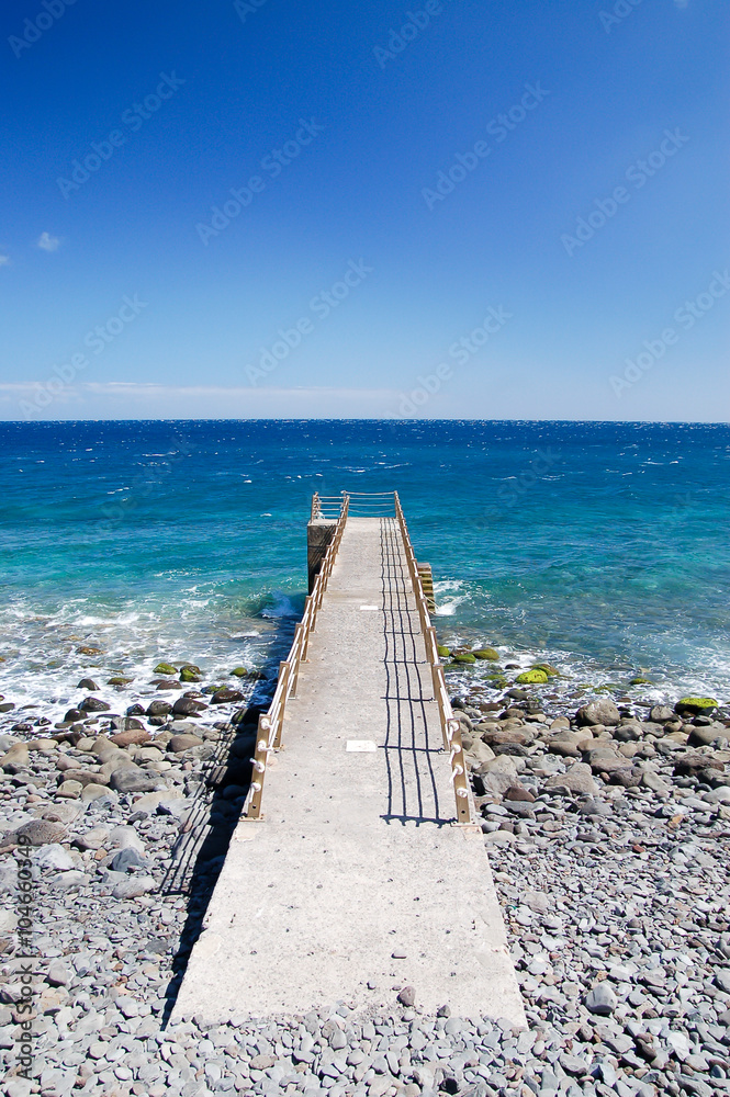 Concrete pier into the ocean
