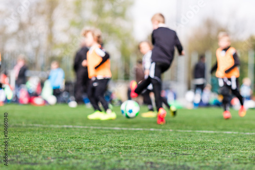 Blur of young boys playing soccer match © Mikkel Bigandt