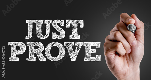 Hand writing the text: Just Prove
