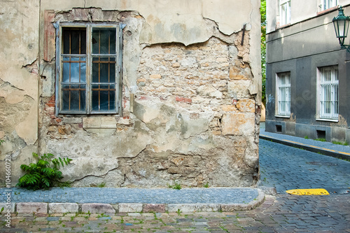 Prague street with old house window
