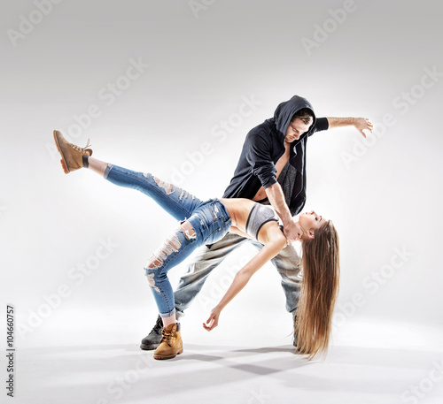 Obraz na plátně Acrobat pose of a two talented dancers