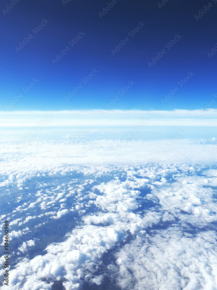 Sky background with clouds and copy space. Sky scene, view outside of an airplane window.  