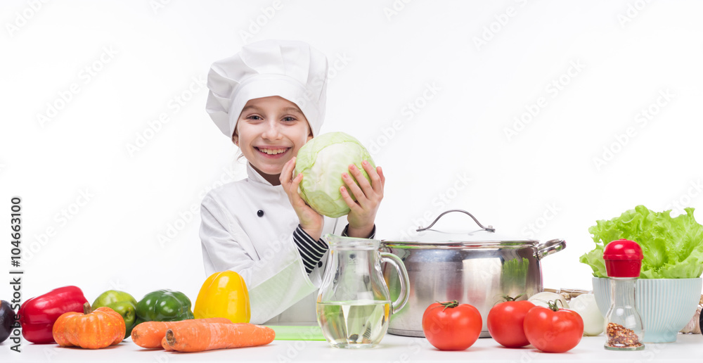little smiling girl-cook with cabbage in hands little smiling girl-cook with cabbage in hands