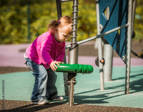 Cute little girl on playground 