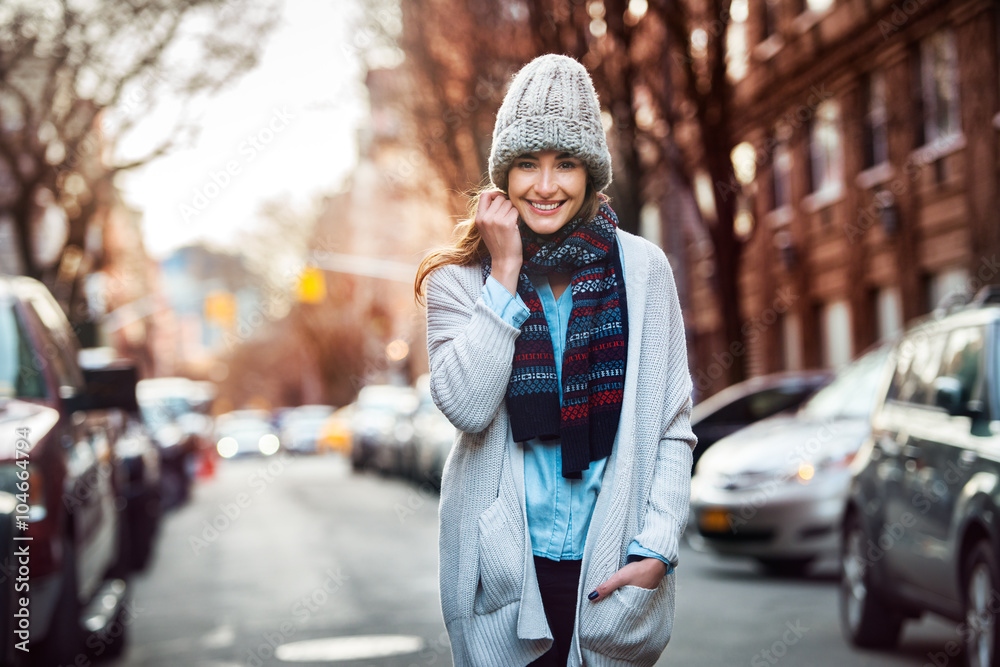 Beautiful smiling woman walking on city street wearing casual style clothes Beautiful smiling woman walking on city street wearing casual style clothes