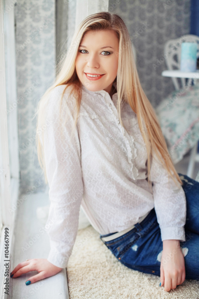 Fototapeta premium beautiful girl in white at the window