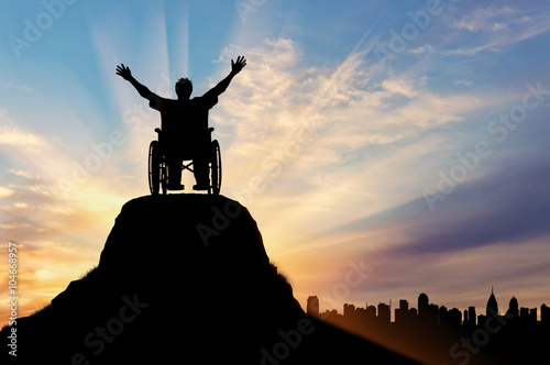 Vászonkép Silhouette happy disabled person