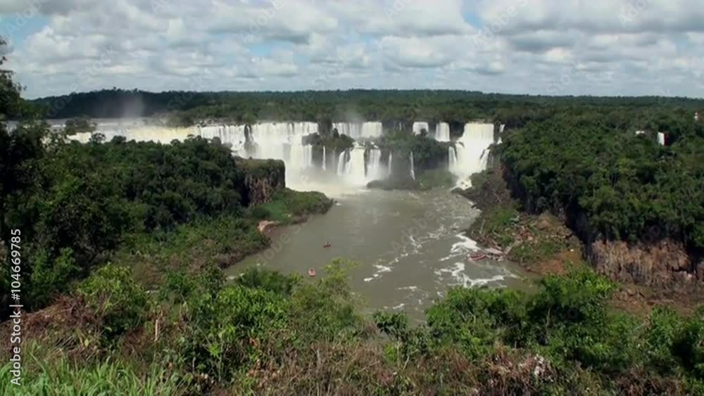 Iguazu semicircular Falls National Park on border of Brazil and Argentina. Made up of many cascades producing vast sprays of water. Iguacu most spectacular waterfalls in world. Natural beauty. Iguazu semicircular Falls National Park on border of Brazil and Argentina. Made up of many cascades producing vast sprays of water. Iguacu most spectacular waterfalls in world. Natural beauty.
