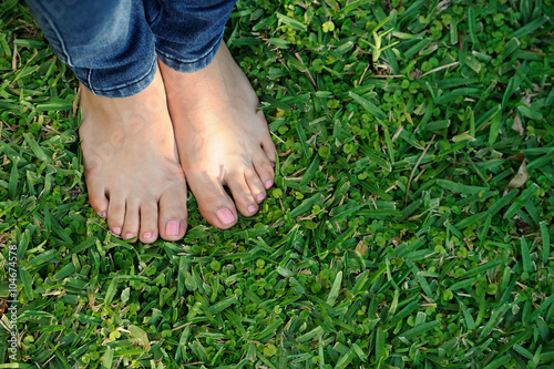 bare foot on green grass