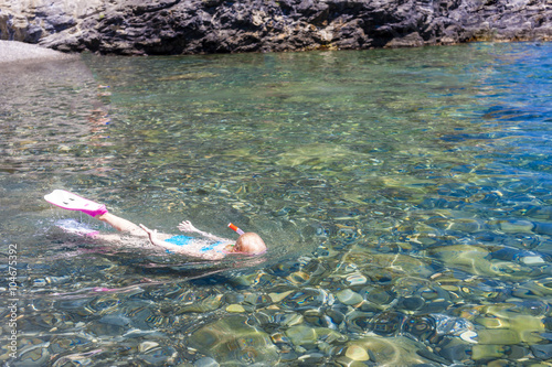 little girl snorkeling in Mediterranean Sea