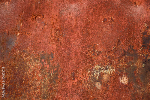 Red painted metal with rust texture background