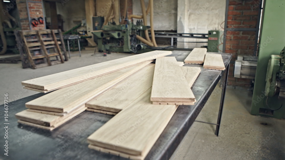 Hardwood lumber stacked on the table. Woodworking for interior carpentry. RAW video record. Hardwood lumber stacked on the table. Woodworking for interior carpentry. RAW video record.