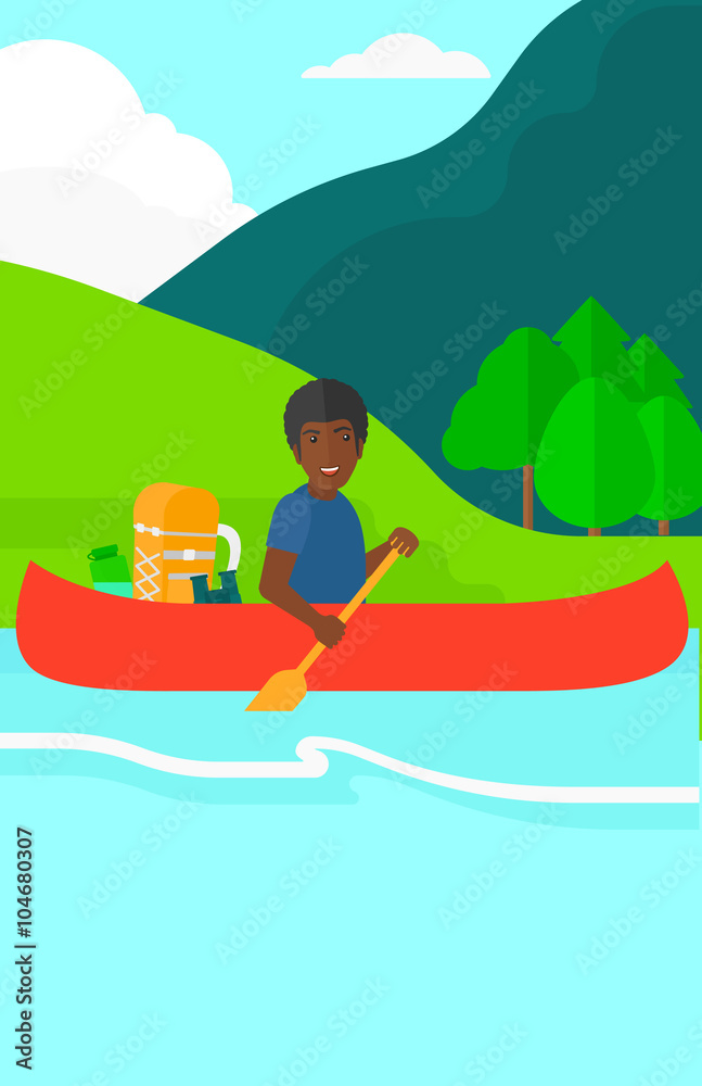 Man canoeing on the river.