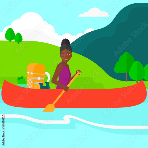 Woman canoeing on the river.