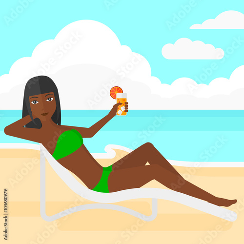 Woman sitting in chaise longue.