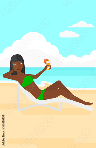 Woman sitting in chaise longue.