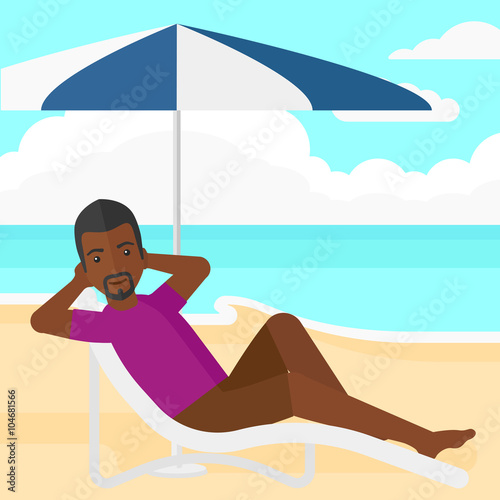 Man sitting in chaise longue.