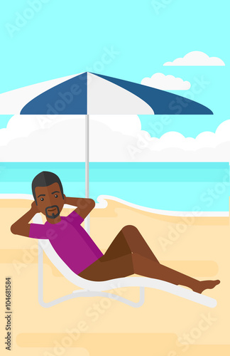 Man sitting in chaise longue.