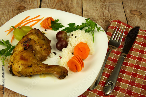 Fried chicken leg on the plate photo