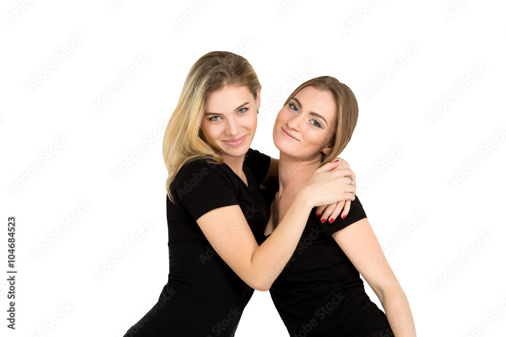 friendship and love: two smiling girls hugging friendship and love: two smiling girls hugging