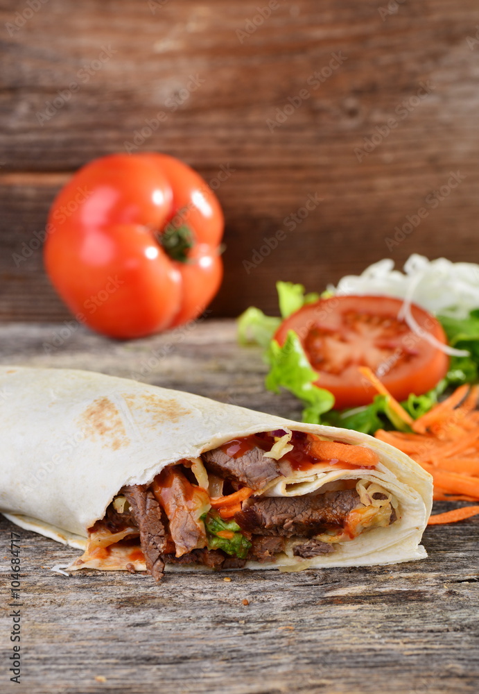 Closeup of tasty kebab with beef and vegetables