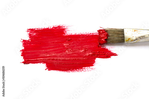 Paint brush with red color and paint stroke isolated on white