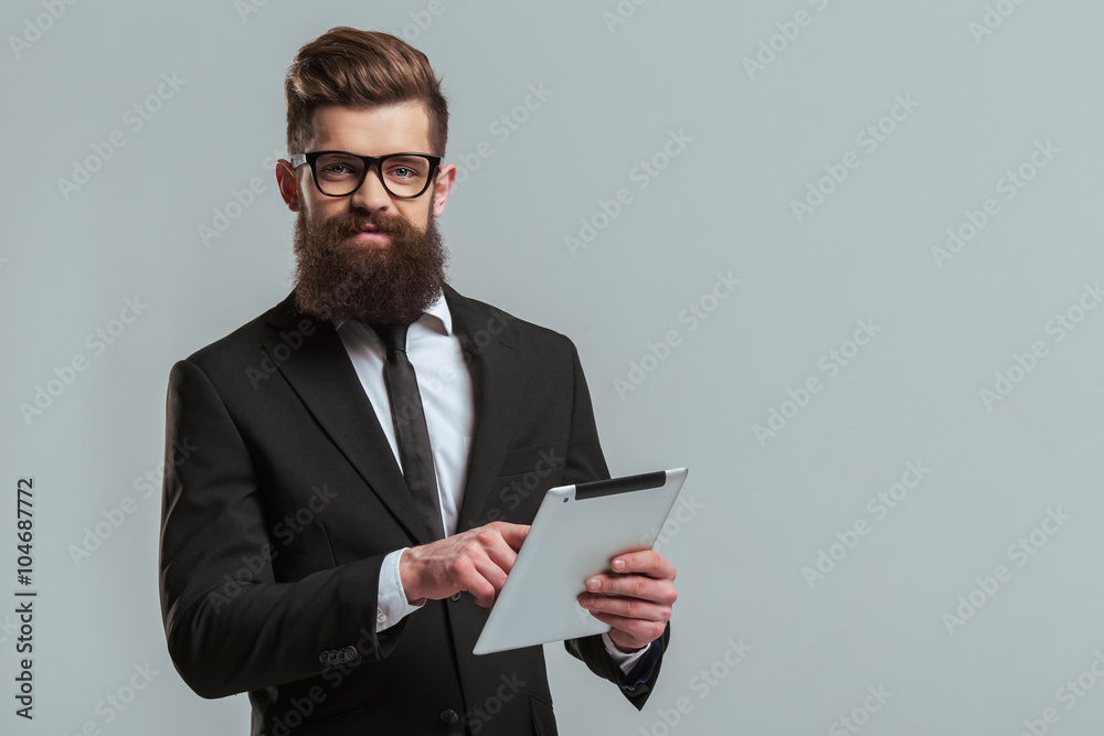 Bearded businessman with gadget Bearded businessman with gadget