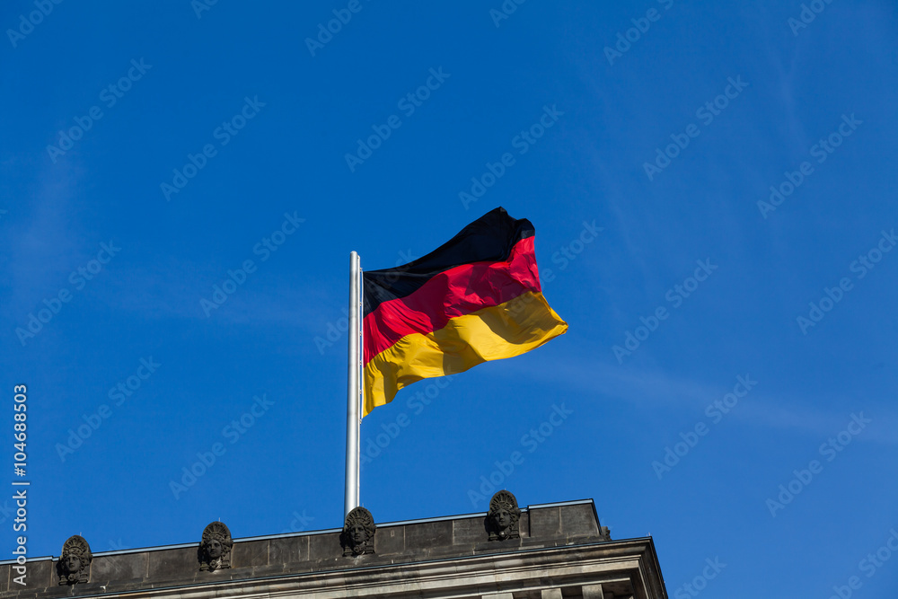 German flag on the top of Reichstag building, Berlin, Germany