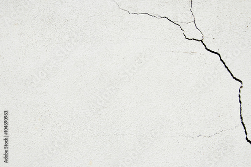 Crack at a corner of a white wall photo