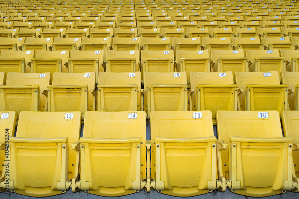 Fototapeta premium Yellow stadium seats on the stadium sport