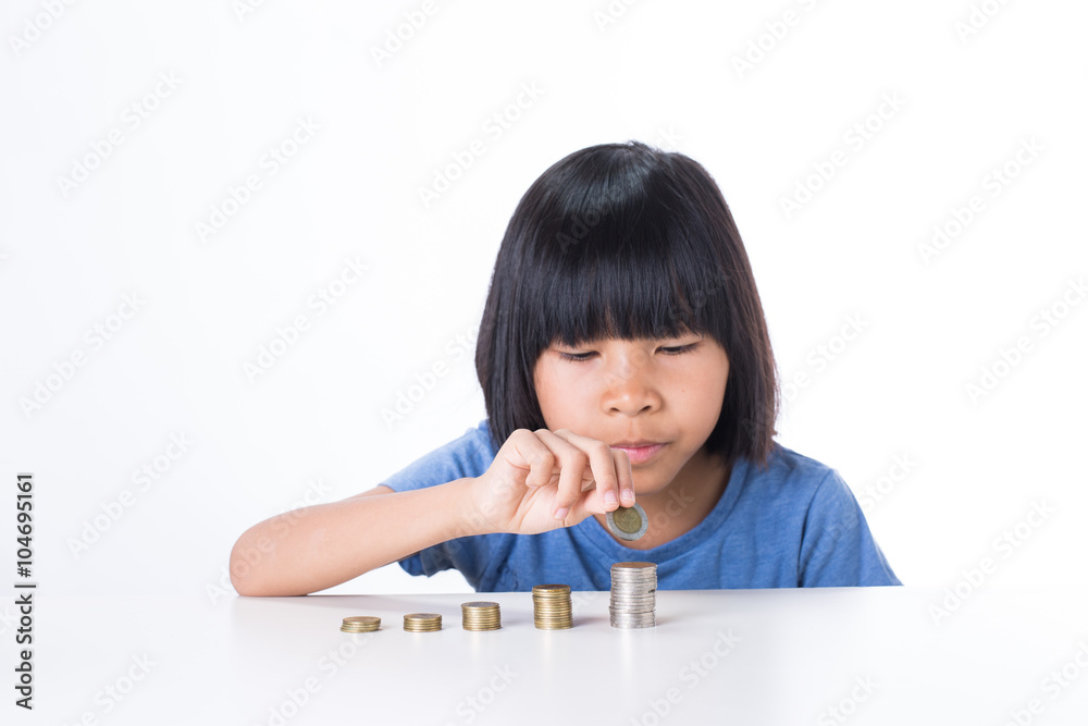 Cute Little asian girl and pile coin for saving. money concept in thinking action with white background Cute Little asian girl and pile coin for saving. money concept in thinking action with white background
