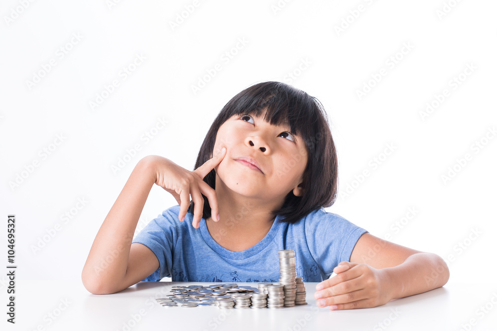 Cute Little asian girl and pile coin for saving. money concept in thinking action with white background Cute Little asian girl and pile coin for saving. money concept in thinking action with white background