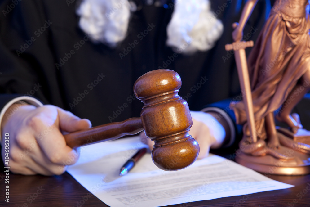 Male judge in a courtroom Male judge in a courtroom
