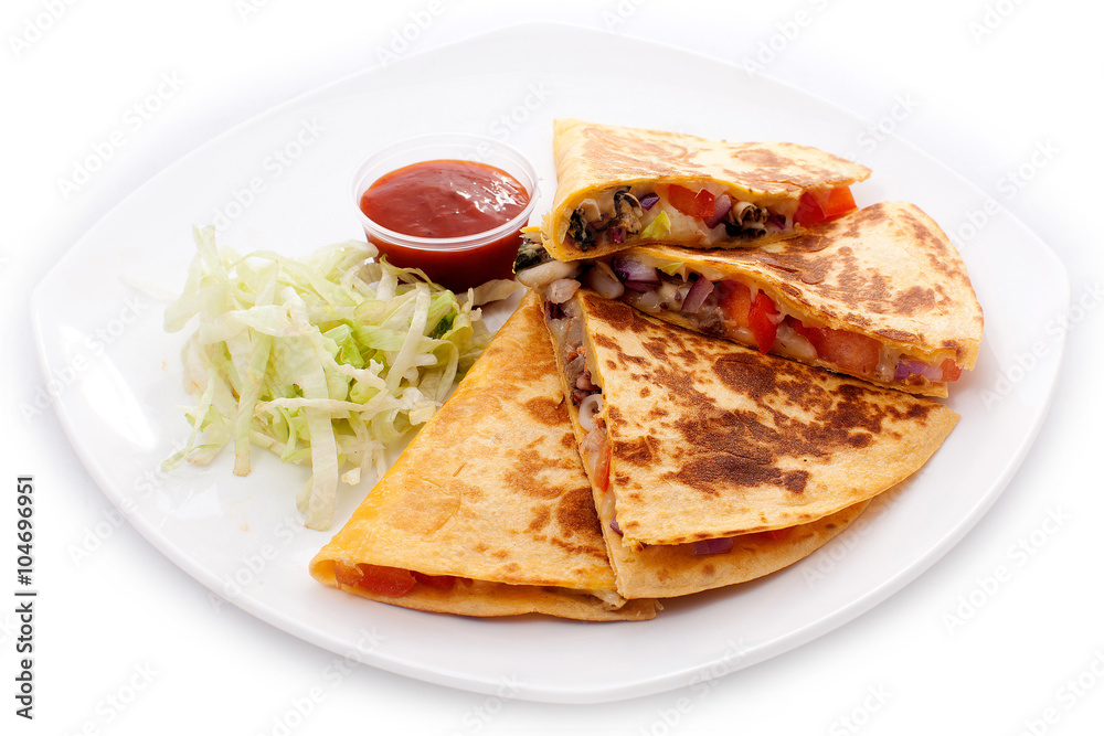 Quesadillas cut into four pieces with ketchup