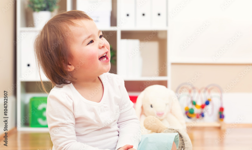 Happy toddler girl smiling in her house Happy toddler girl smiling in her house