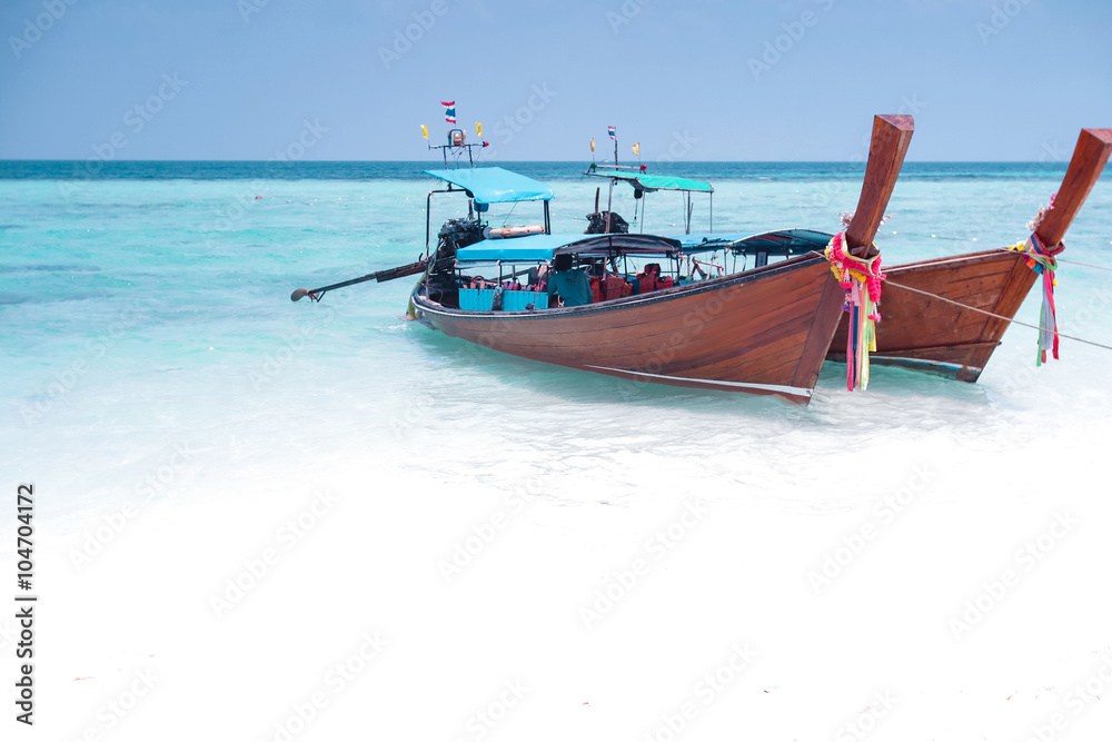 thailand long boat with white sand