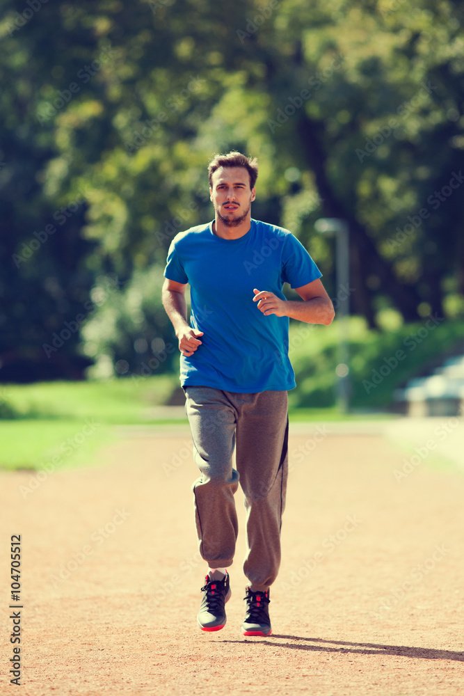 Young man jogging, intentionally toned image. Young man jogging, intentionally toned image.