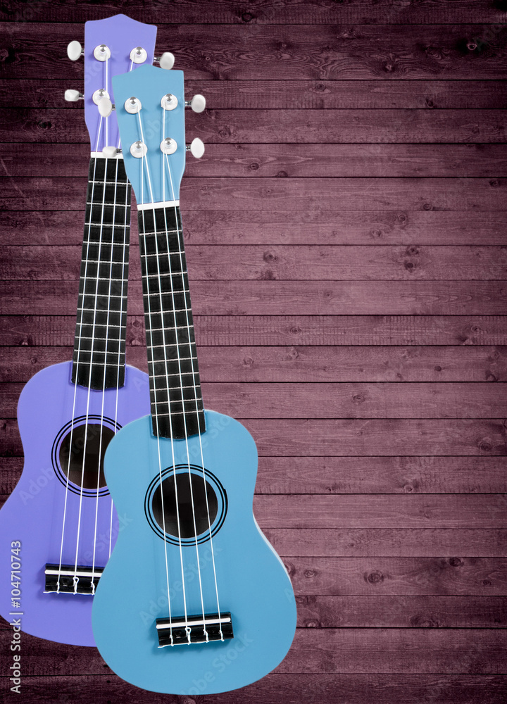 Obraz premium A number of acoustic guitars in the background. Write text