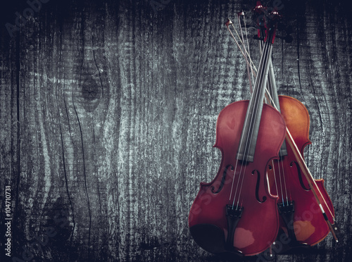 Violin on grey wooden background. With space for text writing © YB