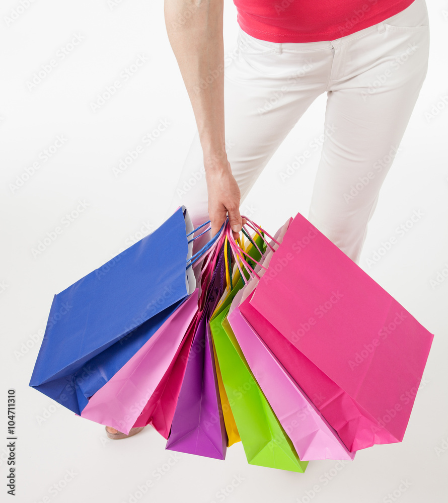 Young woman with multicolored shopping bags