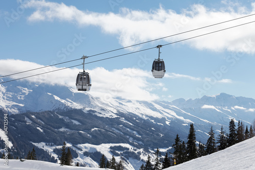 Winter mountains landscape with cable car and beautiful, sunny sky
